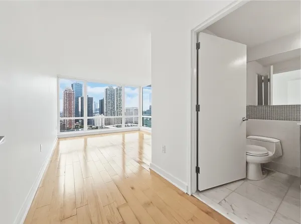 a bathroom with a bathtub and a toilet