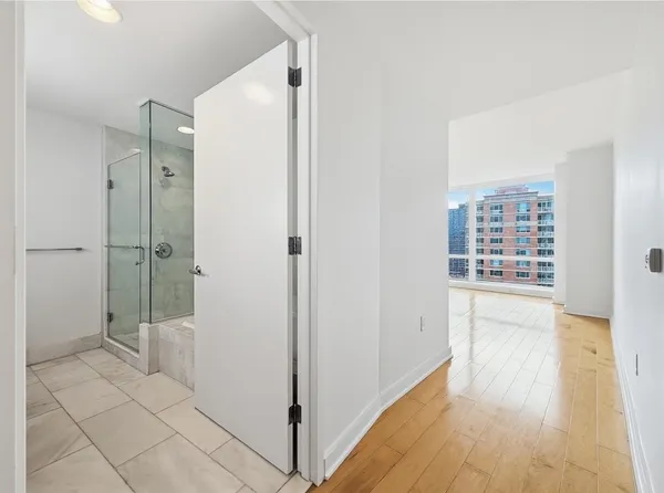 a bathroom with a shower and a toilet