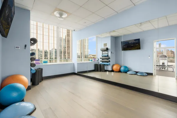 a living room with furniture and flat screen tv