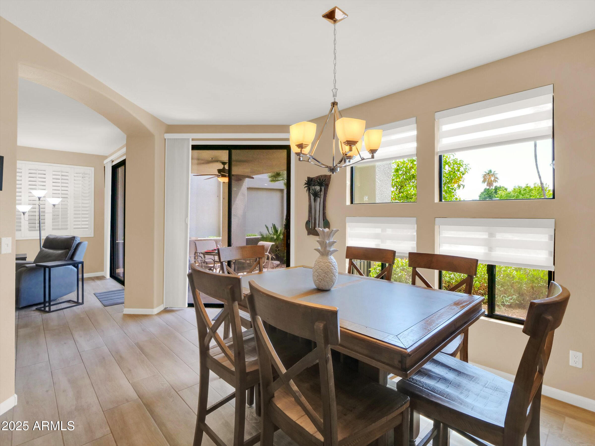 7700 East Gainey Ranch Road, Unit 120 Scottsdale, AZ 85258 - Photo 13 of 57 a view of a dining room with furniture window and outside view