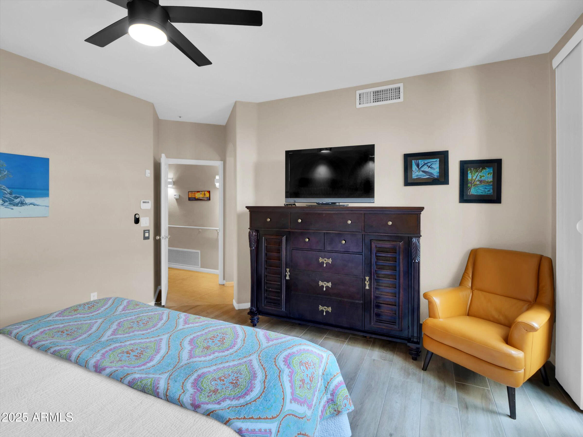 7700 East Gainey Ranch Road, Unit 120 Scottsdale, AZ 85258 - Photo 23 of 57 a living room with furniture and a flat screen tv