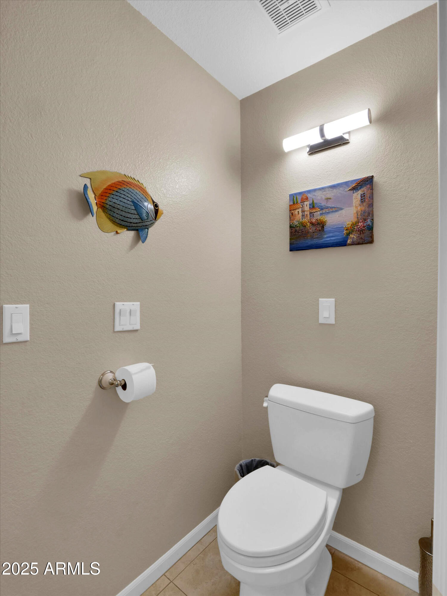 7700 East Gainey Ranch Road, Unit 120 Scottsdale, AZ 85258 - Photo 28 of 57 a white toilet sitting next to a bathroom sink and vanity