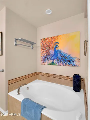 a bathroom with a granite countertop toilet sink and mirror