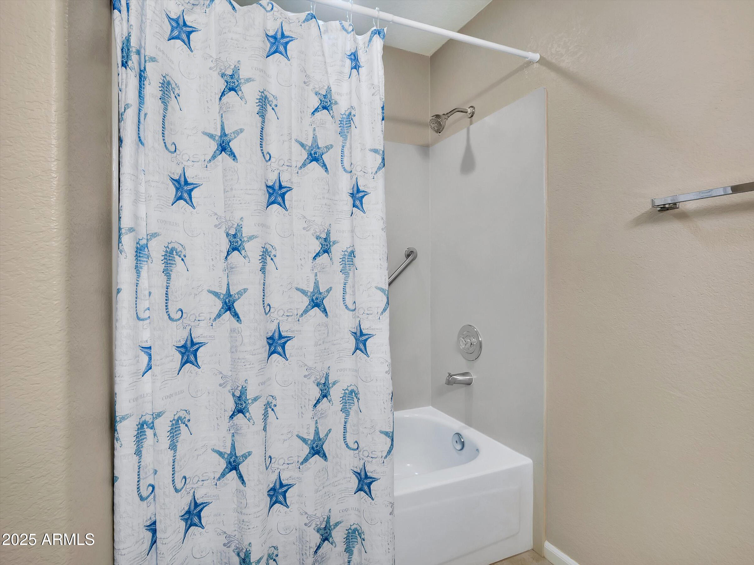7700 East Gainey Ranch Road, Unit 120 Scottsdale, AZ 85258 - Photo 37 of 57 a bathroom with a bathtub and shower