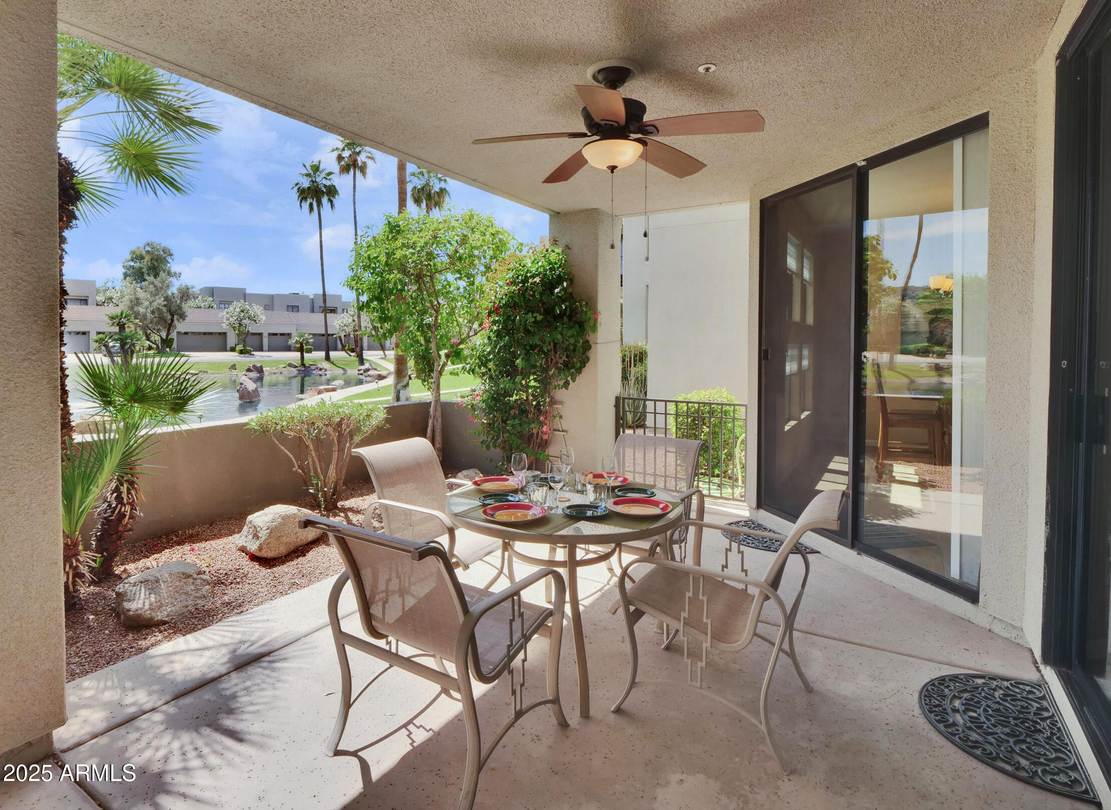 7700 East Gainey Ranch Road, Unit 120 Scottsdale, AZ 85258 - Photo 40 of 57 a view of a dining room with furniture window and outside view