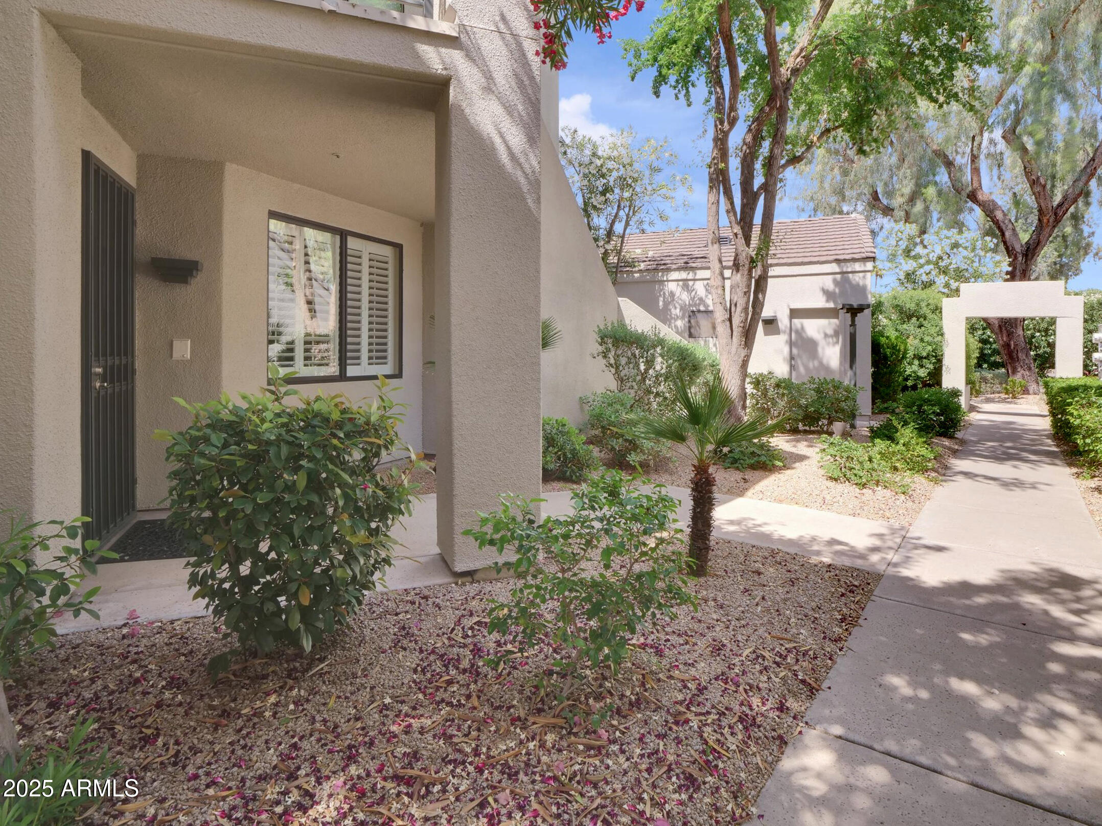 7700 East Gainey Ranch Road, Unit 120 Scottsdale, AZ 85258 - Photo 42 of 57 a view of a pathway with a house