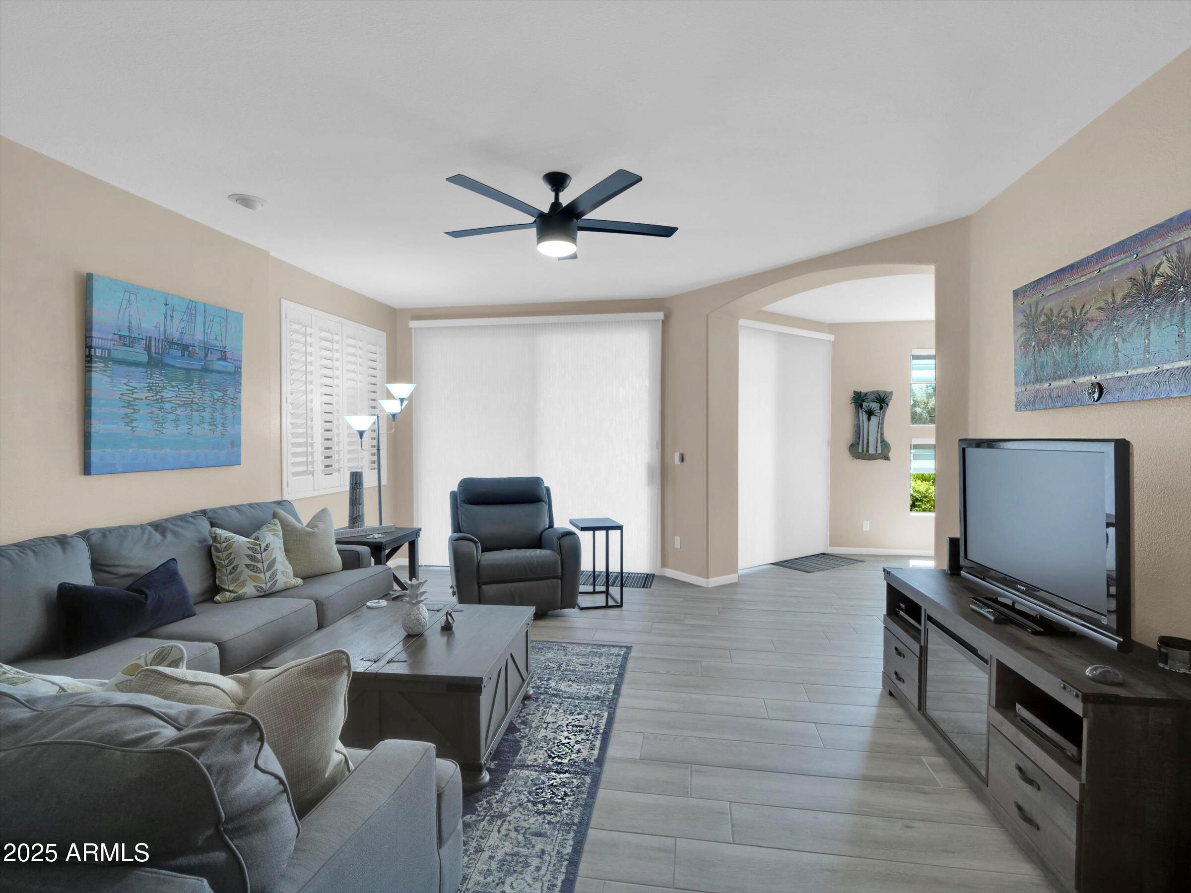7700 East Gainey Ranch Road, Unit 120 Scottsdale, AZ 85258 - Photo 7 of 57 a living room with furniture and a flat screen tv