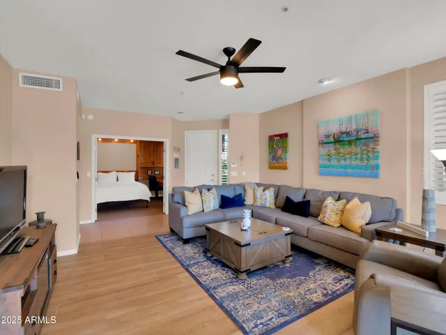 a living room with furniture and a flat screen tv
