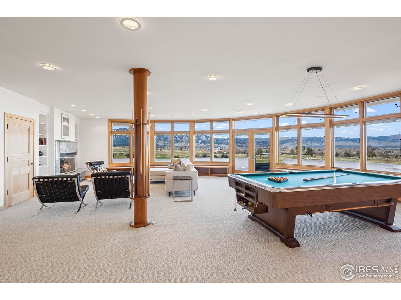 640 South 68th Street Boulder, CO 80303 - Photo 37 of 40 a living room with furniture pool view and large windows