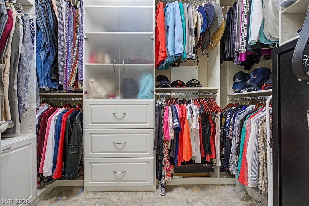 7415 Campbell Ranch Avenue Las Vegas, NV 89179 - Photo 36 of 52 Streamlined closet organization with ample shelving and hanging space for all your wardrobe essentials.