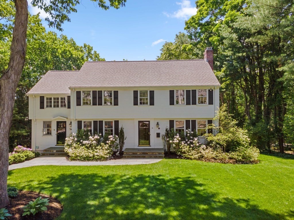10 Sturbridge Road Wellesley, MA 02481 - Photo 1 of 34 a front view of a house with a garden