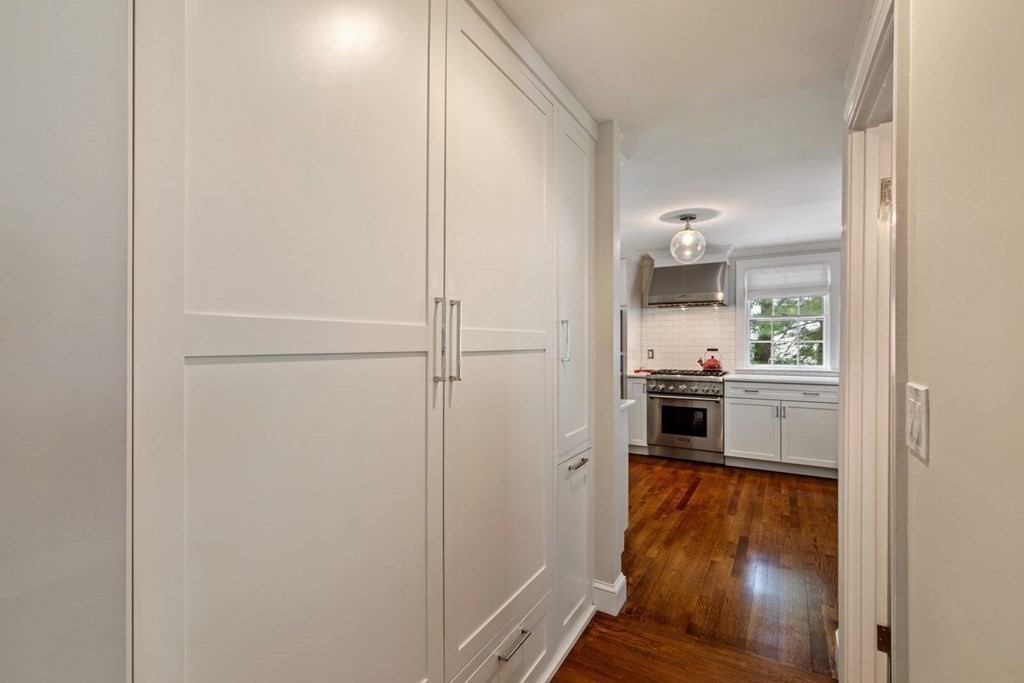 10 Sturbridge Road Wellesley, MA 02481 - Photo 15 of 34 a kitchen with white cabinets and white appliances