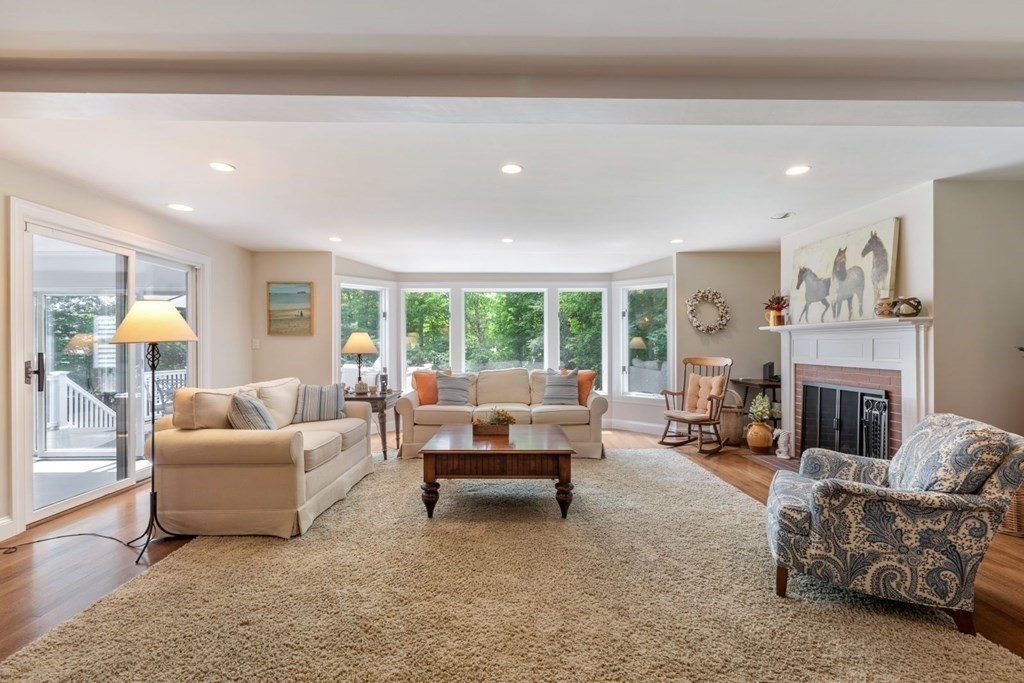 10 Sturbridge Road Wellesley, MA 02481 - Photo 17 of 34 a living room with furniture and a fireplace