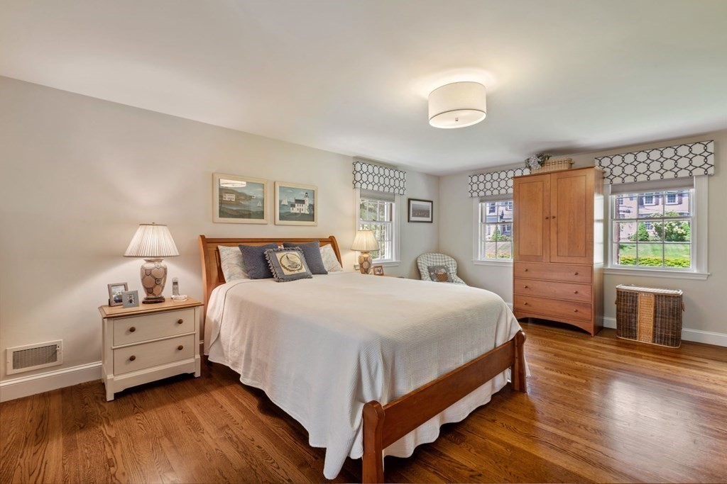 10 Sturbridge Road Wellesley, MA 02481 - Photo 20 of 34 a large bedroom with a bed and wooden floor