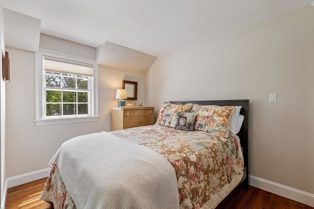 10 Sturbridge Road Wellesley, MA 02481 - Photo 22 of 34 a bedroom with a large bed and a window