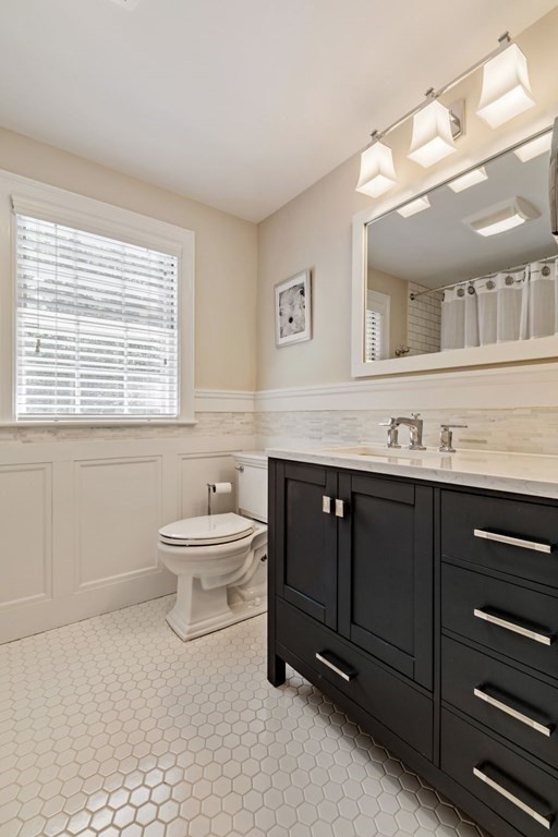 10 Sturbridge Road Wellesley, MA 02481 - Photo 23 of 34 a bathroom with a sink vanity toilet and a mirror