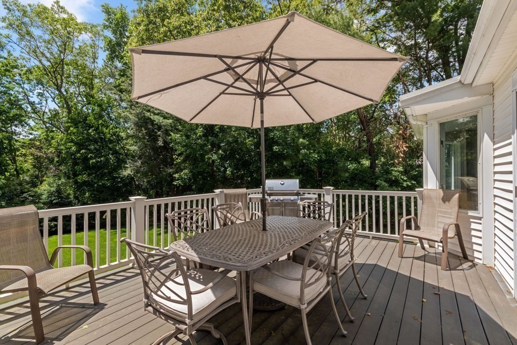 10 Sturbridge Road Wellesley, MA 02481 - Photo 26 of 34 a view of a chair and table on the deck