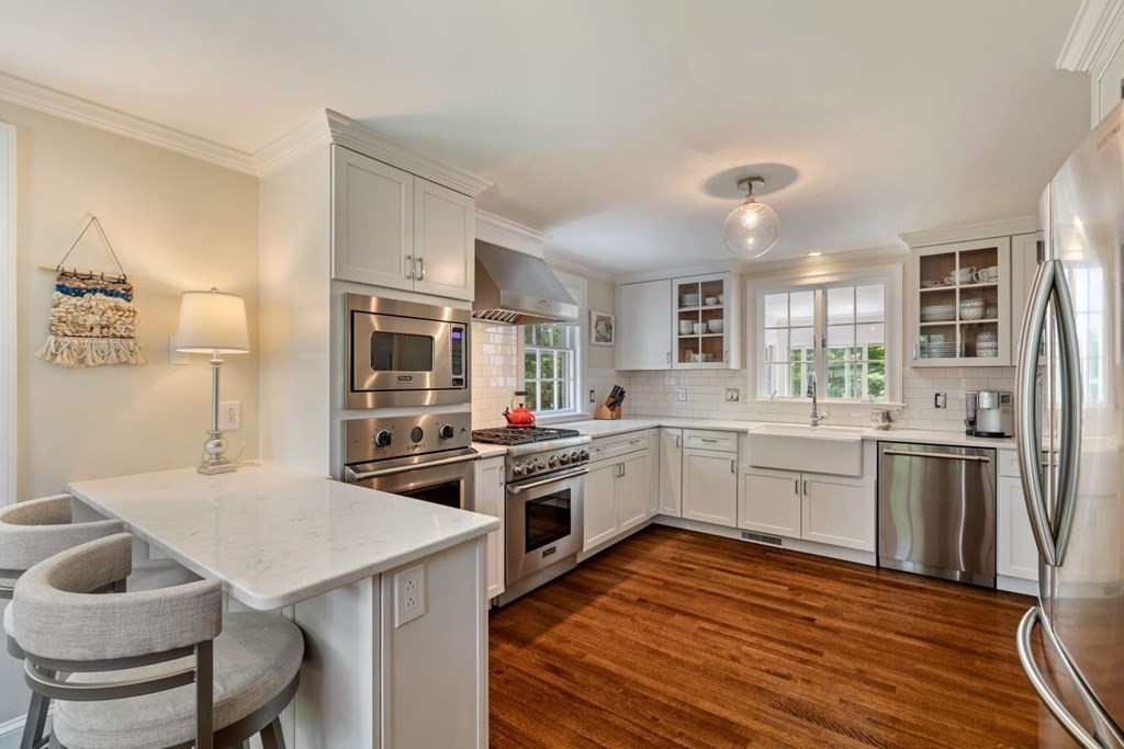 10 Sturbridge Road Wellesley, MA 02481 - Photo 9 of 34 a kitchen with a stove a sink and a refrigerator