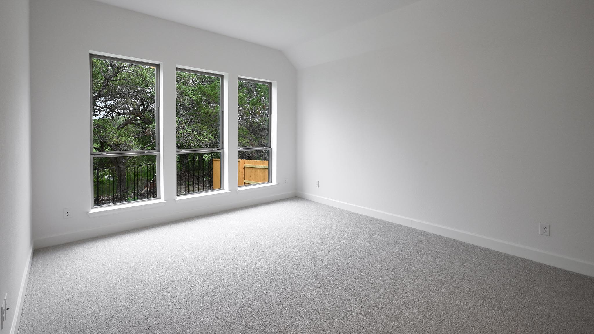 268 Basket Flower Loop Kyle, TX 78640 - Photo 8 of 27 a view of a big room with large windows