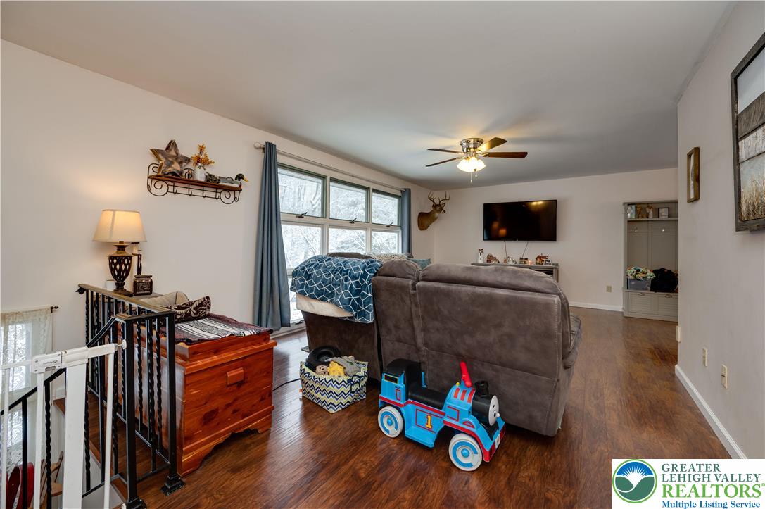 6838 Lime Kiln Road Slatington, PA 18080 - Photo 12 of 60 a living room with furniture and a flat screen tv