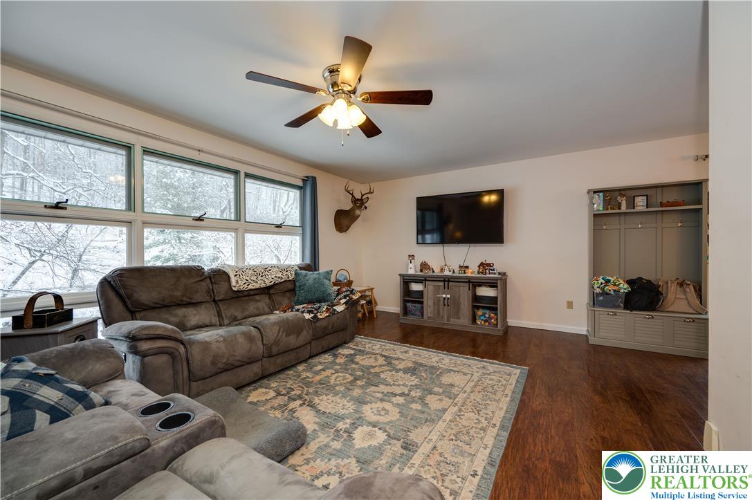 6838 Lime Kiln Road Slatington, PA 18080 - Photo 13 of 60 a living room with furniture and a flat screen tv