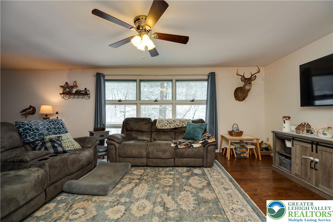 6838 Lime Kiln Road Slatington, PA 18080 - Photo 14 of 60 a living room with furniture and a flat screen tv