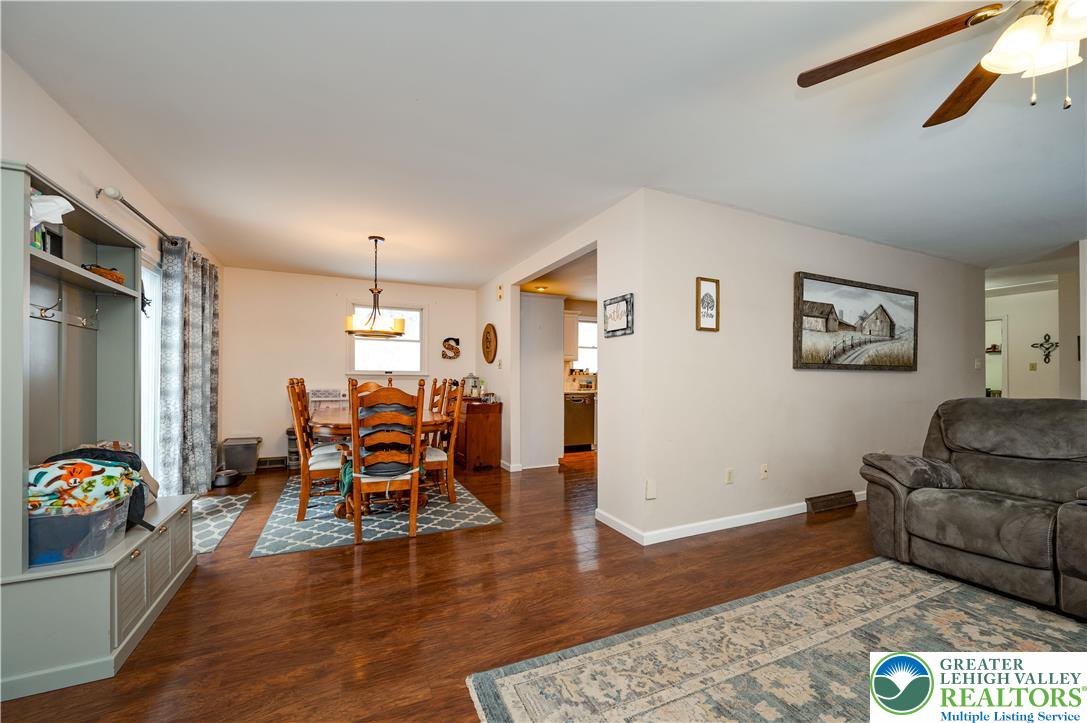 6838 Lime Kiln Road Slatington, PA 18080 - Photo 17 of 60 a living room with furniture and a wooden floor