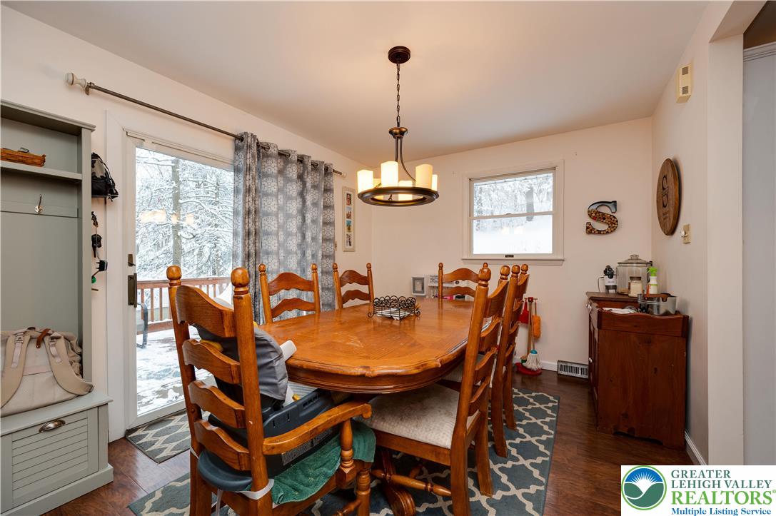 6838 Lime Kiln Road Slatington, PA 18080 - Photo 19 of 60 a dining room with furniture a chandelier and window
