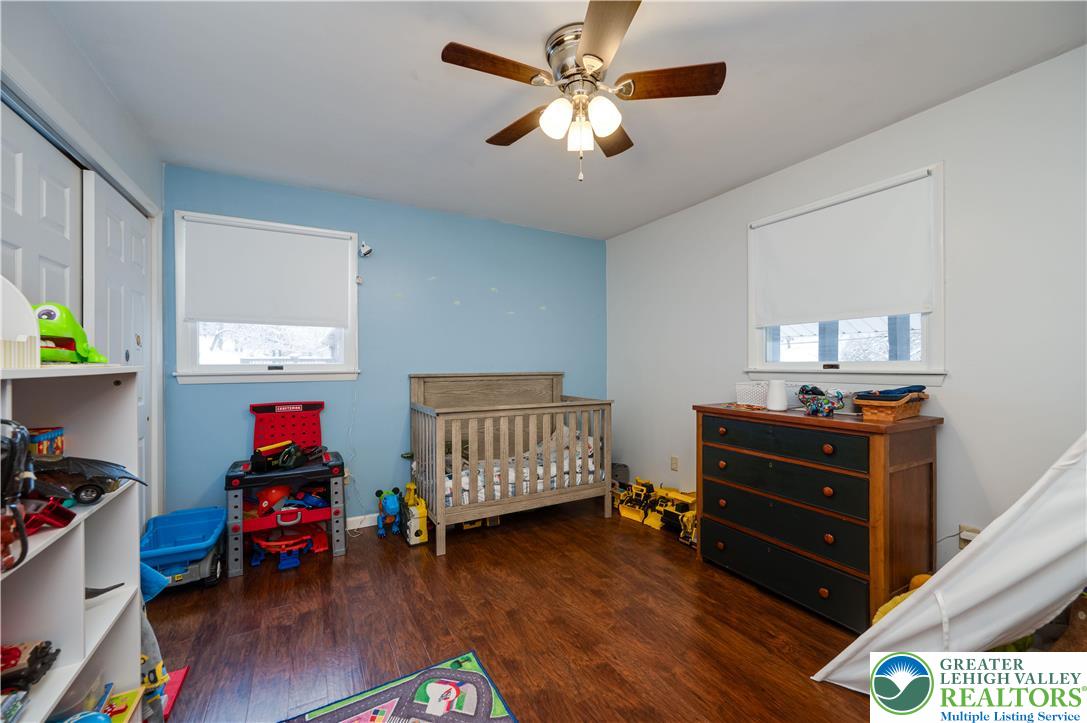 6838 Lime Kiln Road Slatington, PA 18080 - Photo 27 of 60 a bedroom with a bed and wooden floor