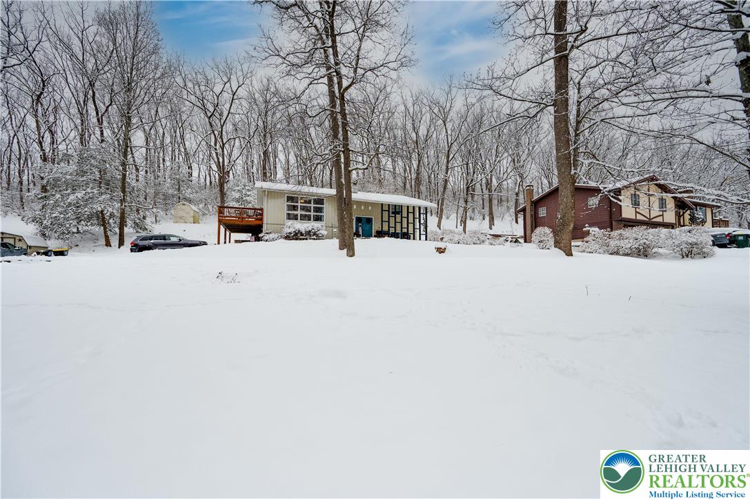 6838 Lime Kiln Road Slatington, PA 18080 - Photo 3 of 60 a view of parking space with truck parked on the road