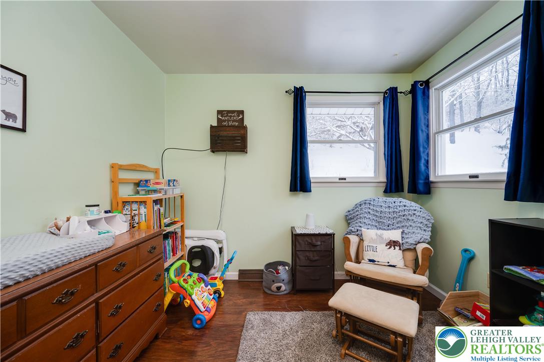 6838 Lime Kiln Road Slatington, PA 18080 - Photo 32 of 60 a bedroom with furniture a rug toys and a window