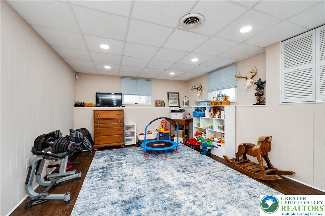 6838 Lime Kiln Road Slatington, PA 18080 - Photo 37 of 60 a room with gym equipment and a flat screen tv