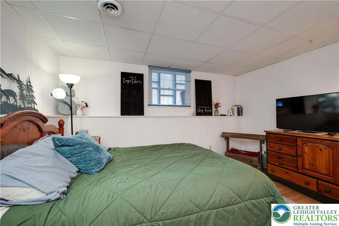 6838 Lime Kiln Road Slatington, PA 18080 - Photo 44 of 60 a bedroom with a bed and a flat screen television