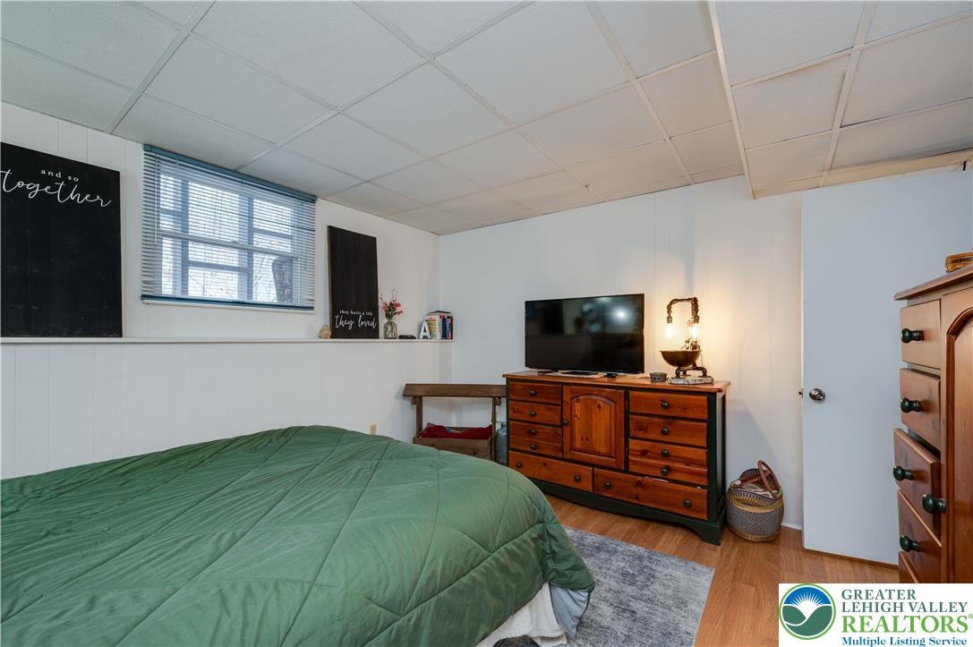 6838 Lime Kiln Road Slatington, PA 18080 - Photo 45 of 60 a bedroom with a bed and flat screen tv