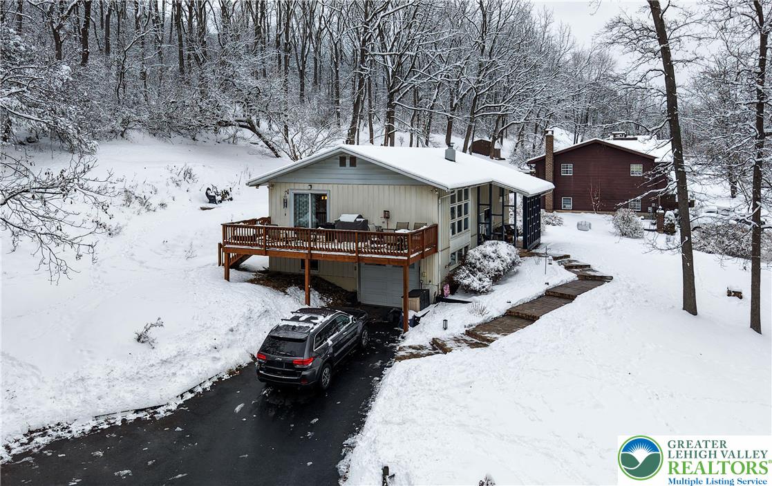 6838 Lime Kiln Road Slatington, PA 18080 - Photo 54 of 60 a front view of a house with a yard covered in snow