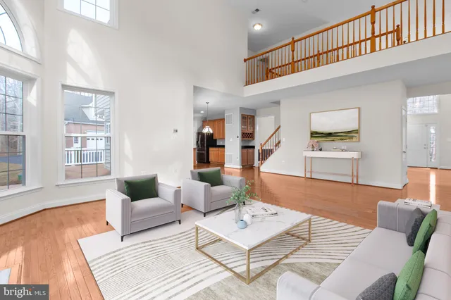 a view of a dining room with furniture wooden floor and chandelier