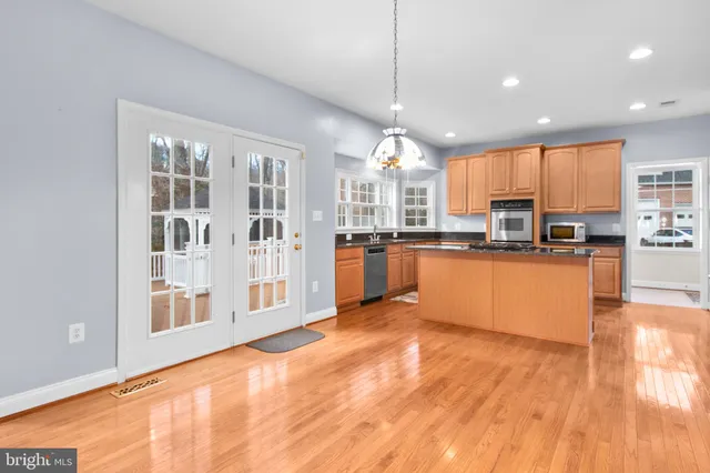 a bedroom with a bed lamp and a window