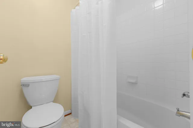 a view of a house with a small yard and a large window