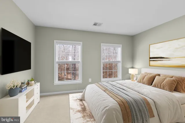 a view of a house with wooden fence