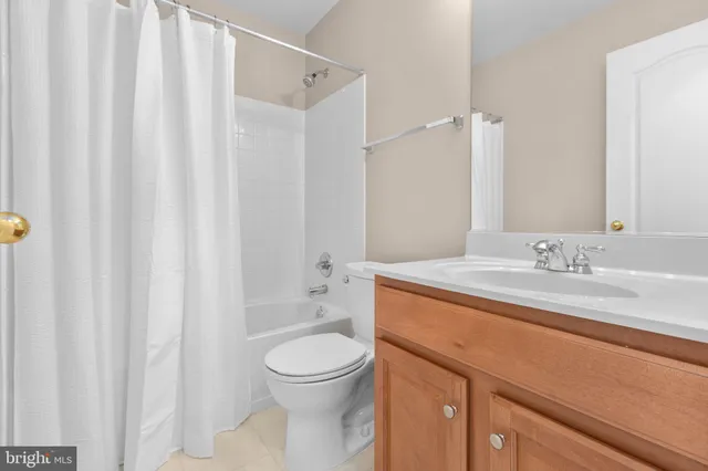 a view of a brick house with many windows