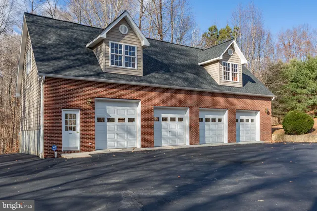 a view of living room with a large window and a fireplace