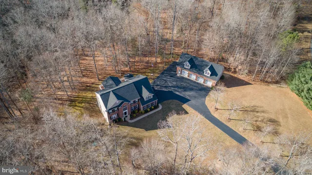 a kitchen with stainless steel appliances granite countertop a stove a sink a refrigerator and island