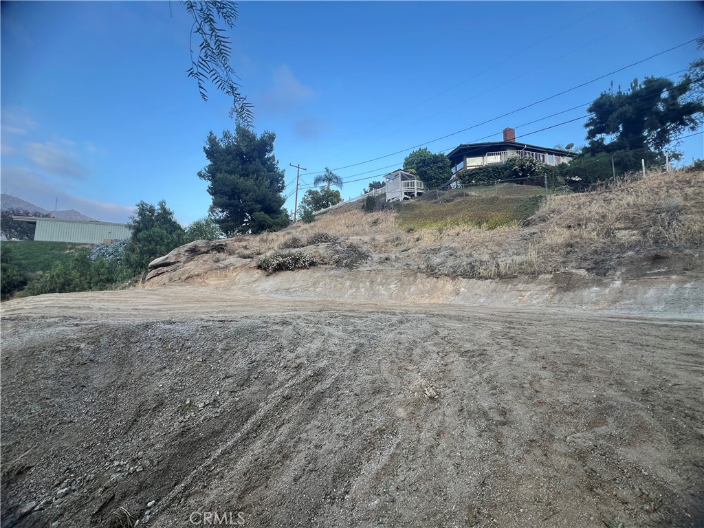 20254 West Point Drive Riverside, CA 92507 - Photo 3 of 7 a view of a dirt road with a building in the background