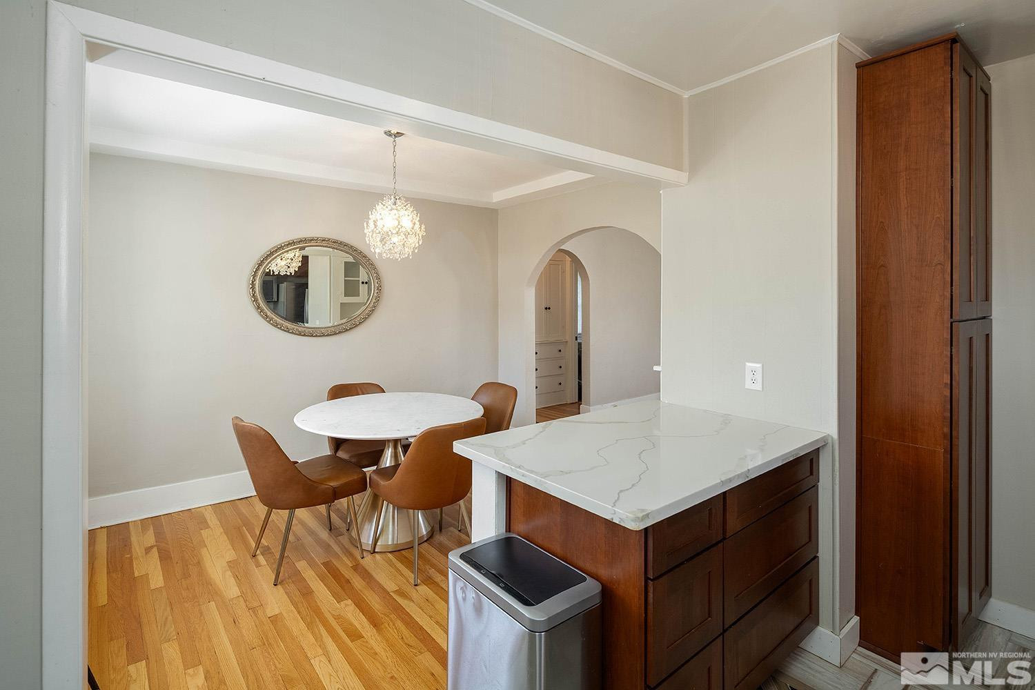 207 Martin Street Reno, NV 89509 - Photo 11 of 40 a view of kitchen and dining area with chandelier