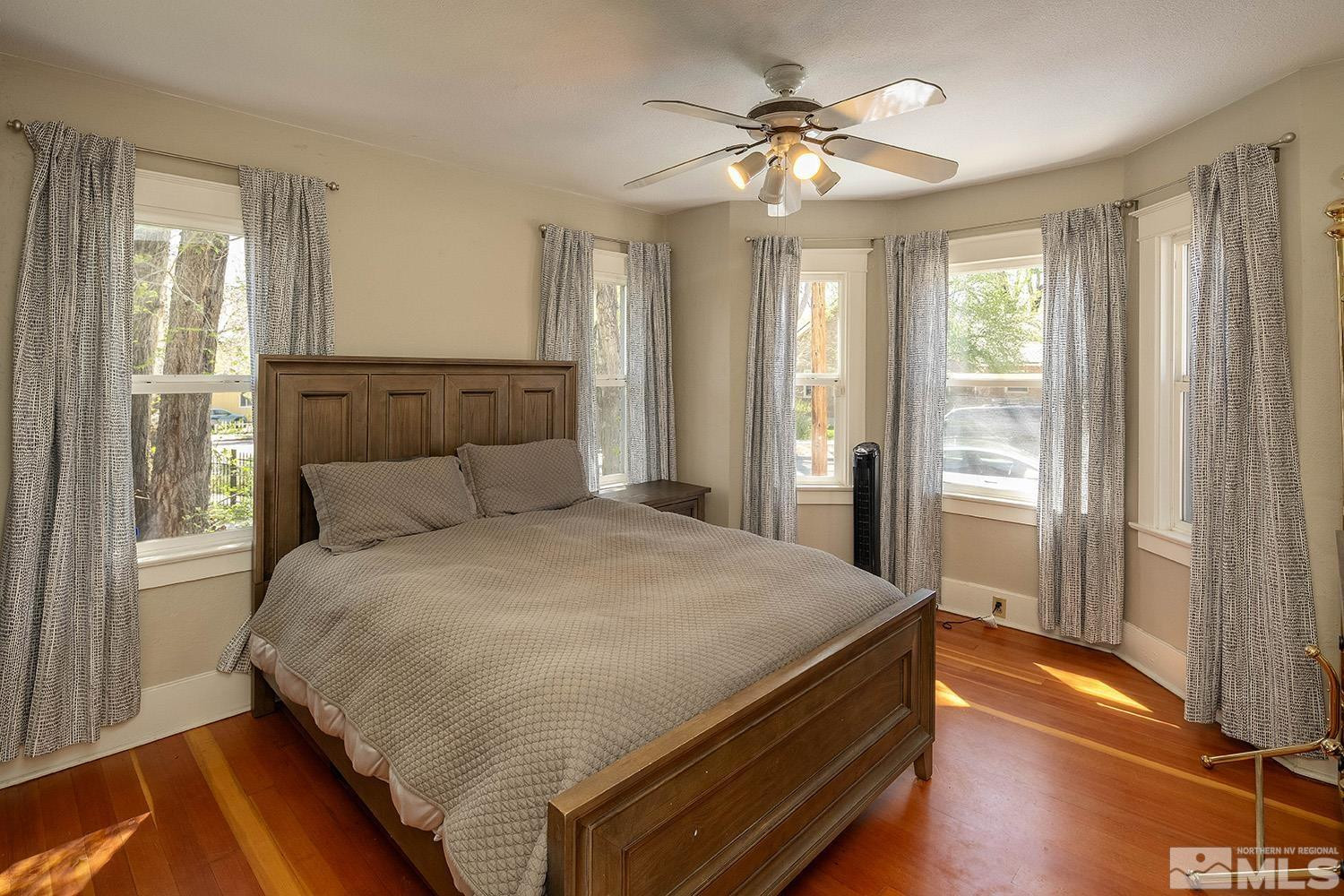 207 Martin Street Reno, NV 89509 - Photo 12 of 40 a bed sitting in a spacious bedroom next to a window