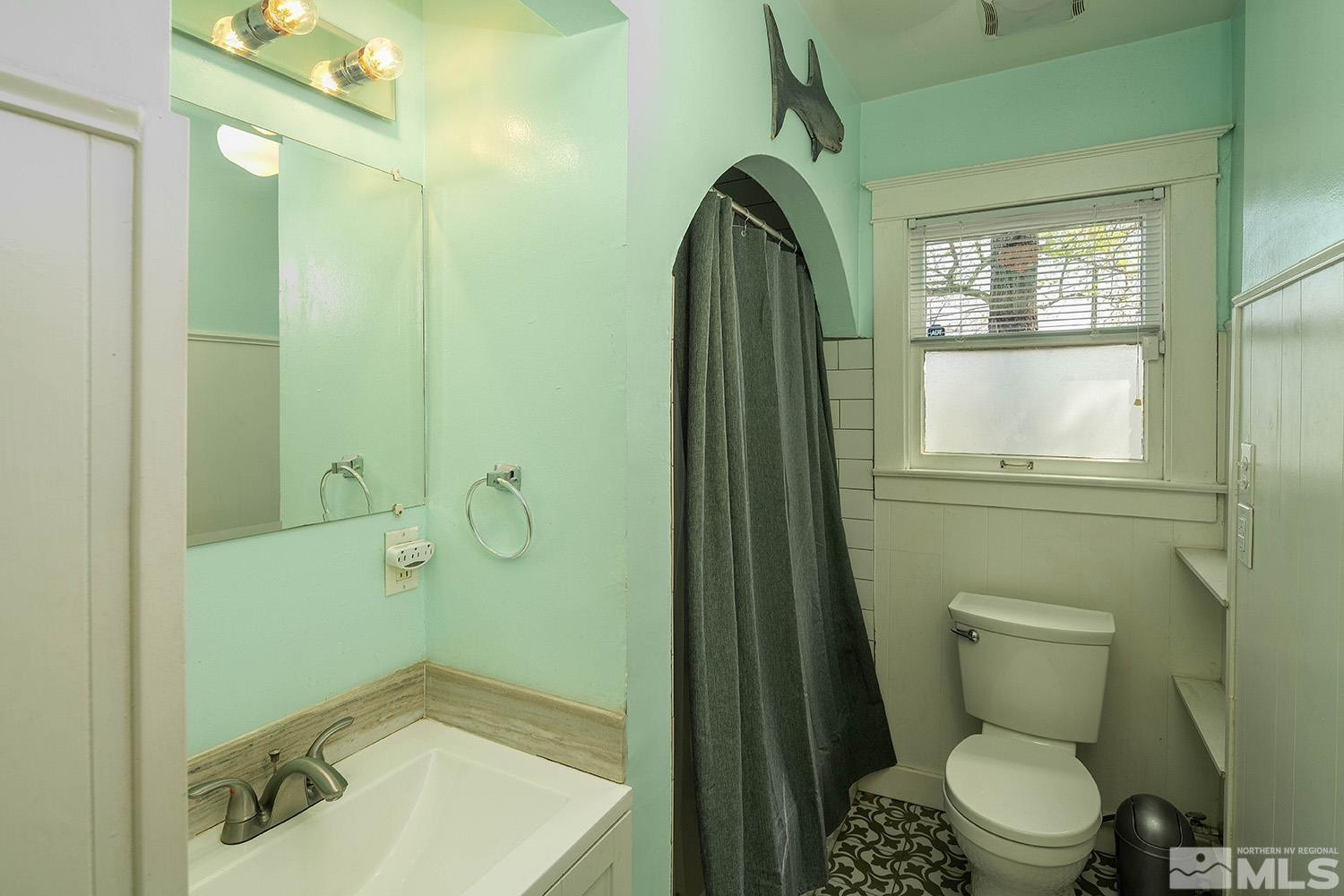 207 Martin Street Reno, NV 89509 - Photo 19 of 40 a bathroom with a toilet and a sink