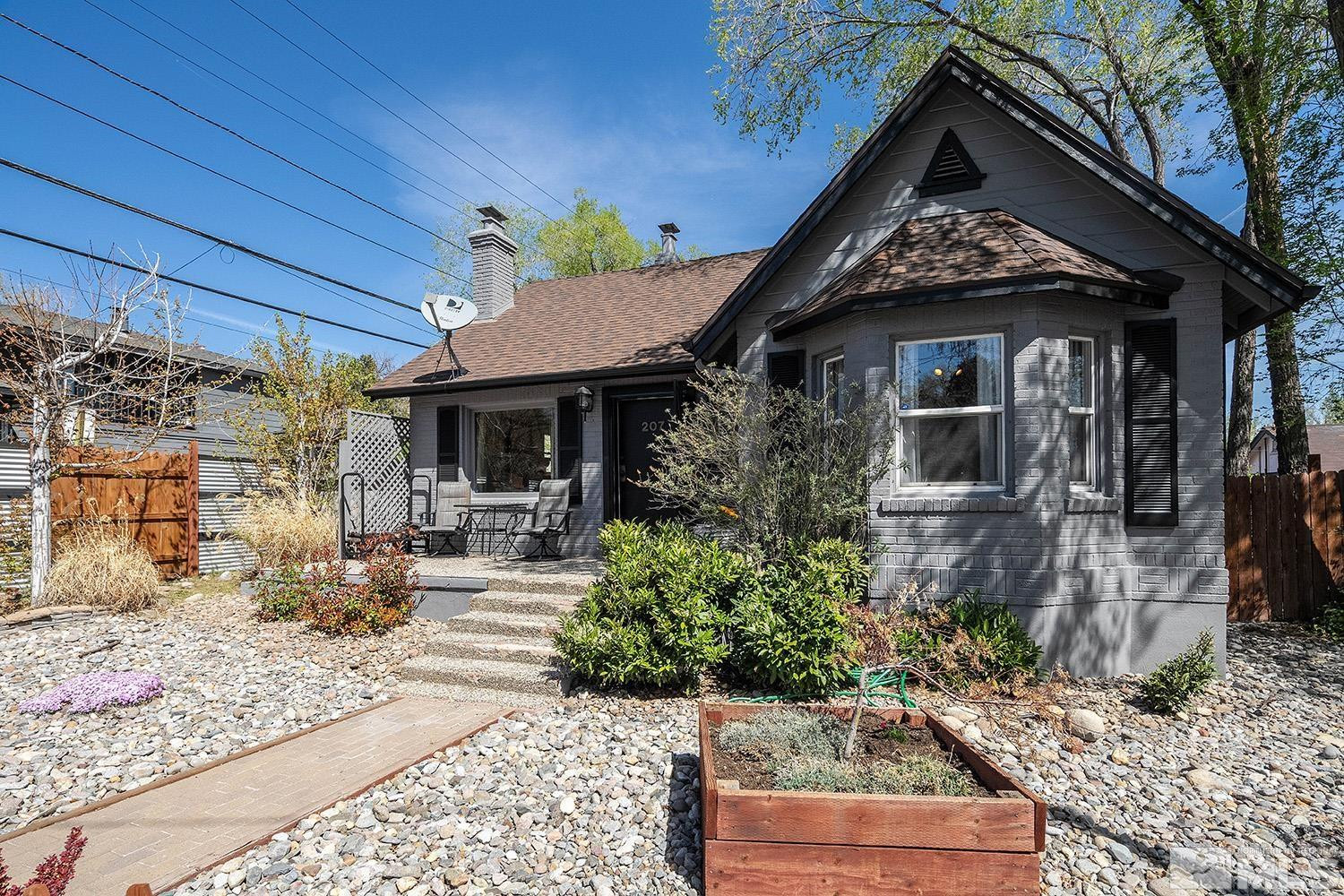 207 Martin Street Reno, NV 89509 - Photo 20 of 40 a front view of a house with garden