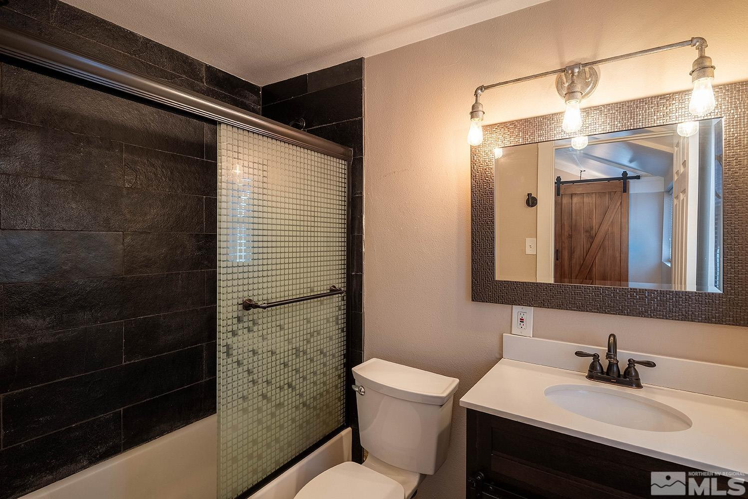 207 Martin Street Reno, NV 89509 - Photo 31 of 40 a bathroom with a sink toilet and shower
