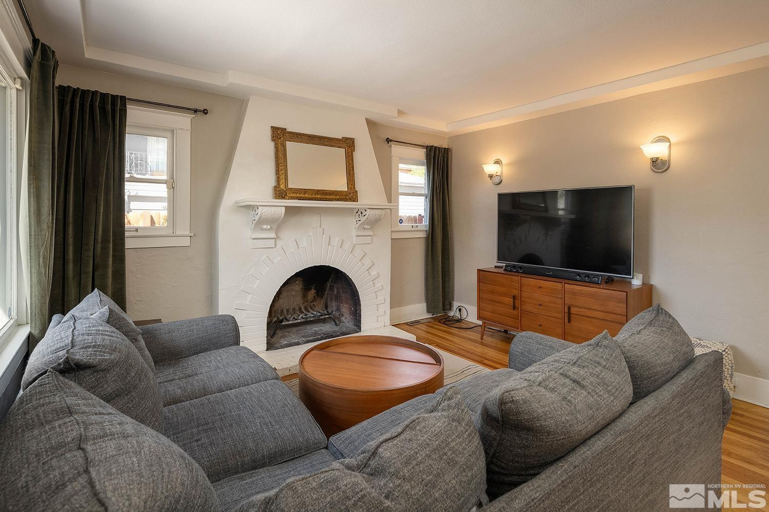 207 Martin Street Reno, NV 89509 - Photo 4 of 40 a living room with furniture and a flat screen tv