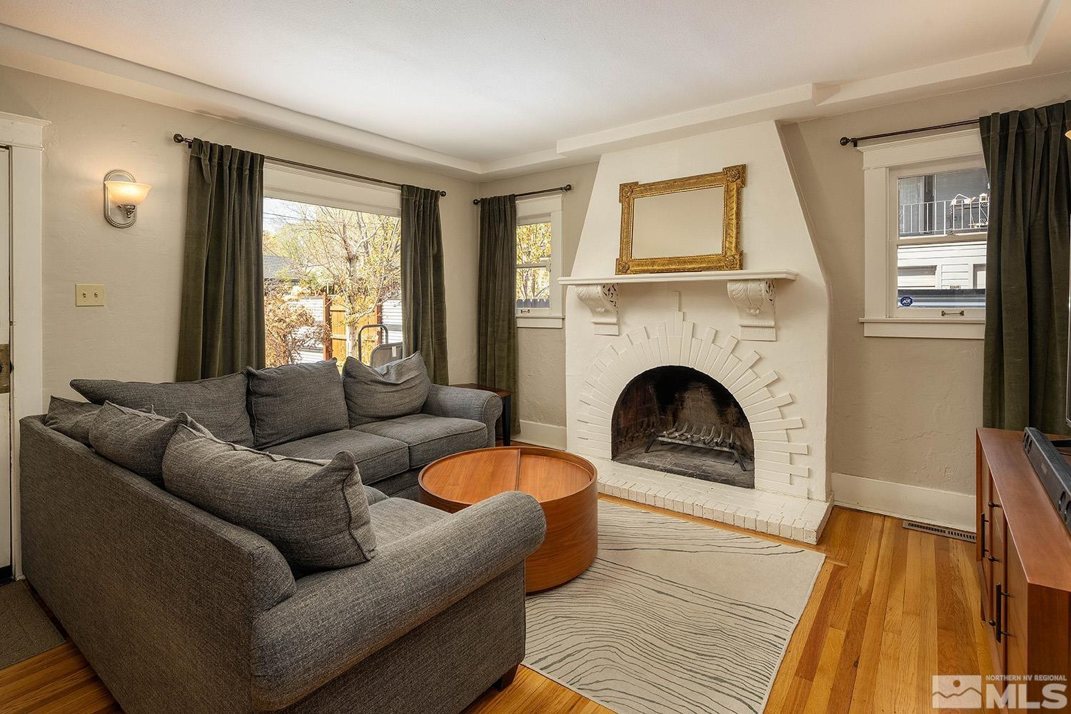 207 Martin Street Reno, NV 89509 - Photo 5 of 40 a living room with furniture and a fireplace